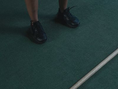 Close up of sports equipment on a dark wooden floor